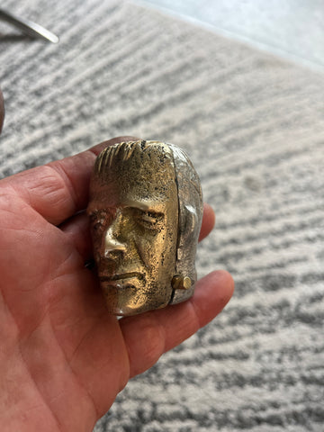 Brass face Hermie