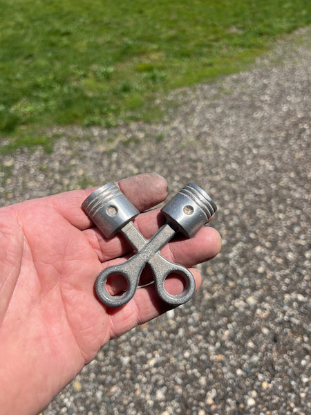 Double piston badge