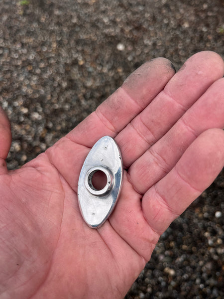 Polished oval toggle switch bezel