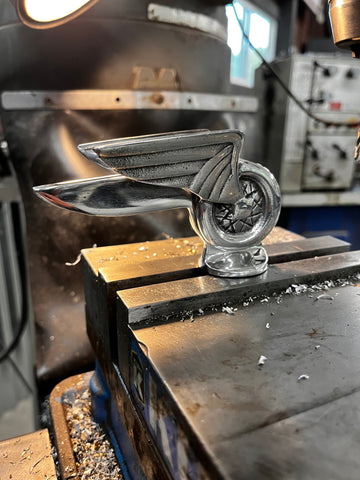 Winged Wheel hood ornament